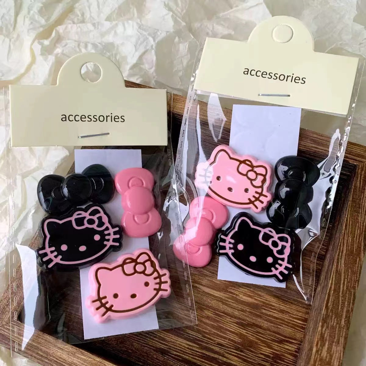 Black and pink Hello kitty charms