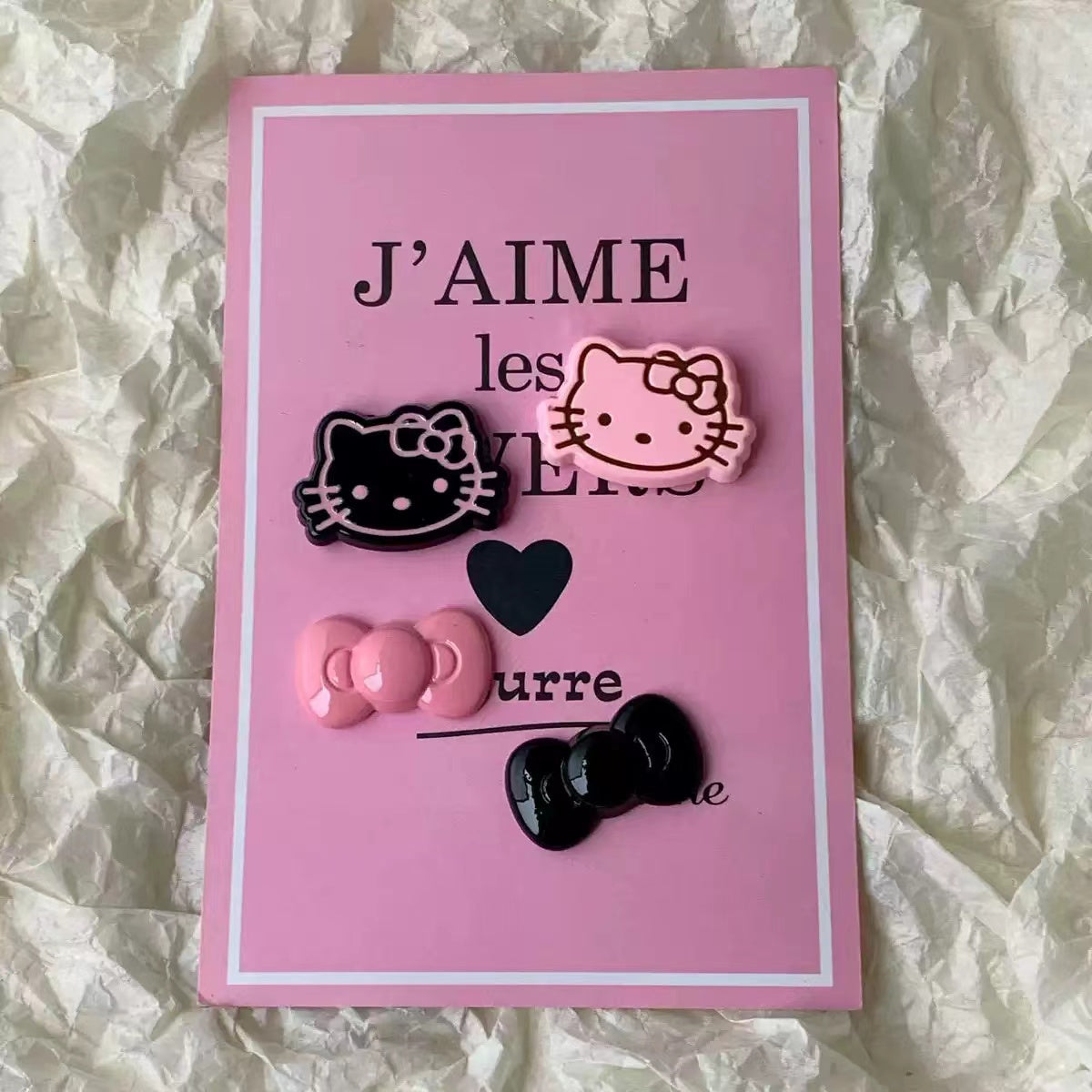 Black and pink Hello kitty charms